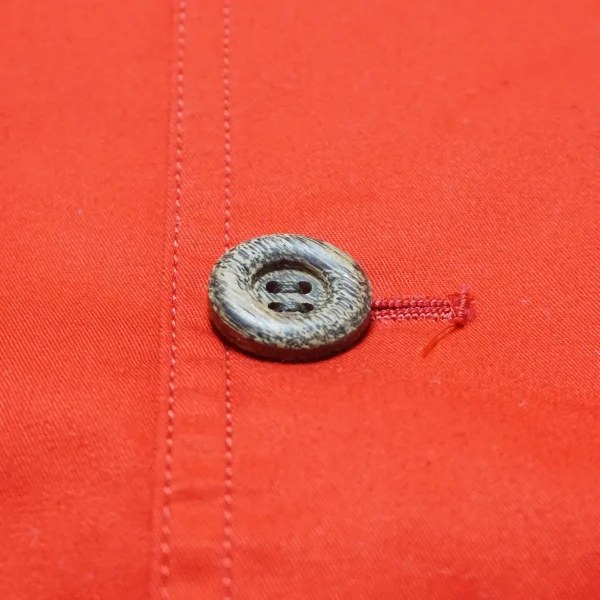 Vintage-style processed wood buttons on McQueen Jacket